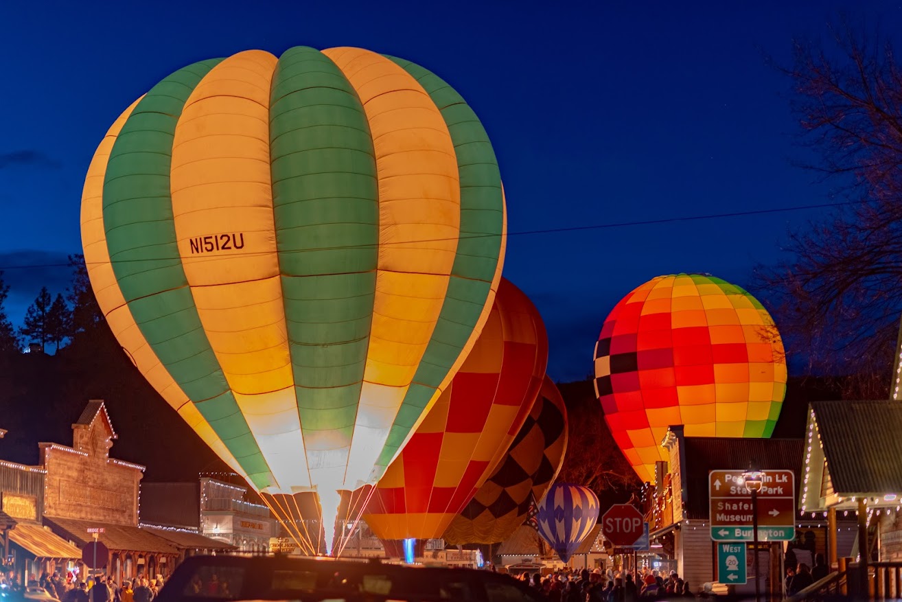Vintage hot air balloons glowing at the Winthrop Balloon Glow